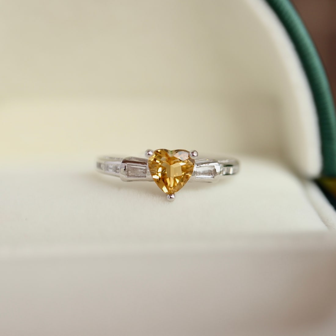 S925 Silver Natural Citrine Ring: This ring features natural 5A-grade citrine in a heart shape, showcasing a rich golden hue. The diamond-cut craftsmanship allows it to shine with a cool white brilliance. With its minimal blemishes an