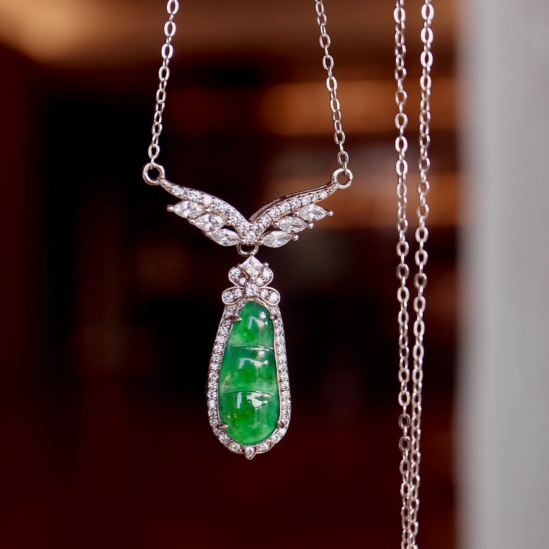 S925 Silver Natural Jade Necklace: This necklace is crafted from natural jade, showcasing rich golden and cool white hues with a flawless texture. The perfectly round jade centerpiece is set in a luxurious S925 silver setting, offering