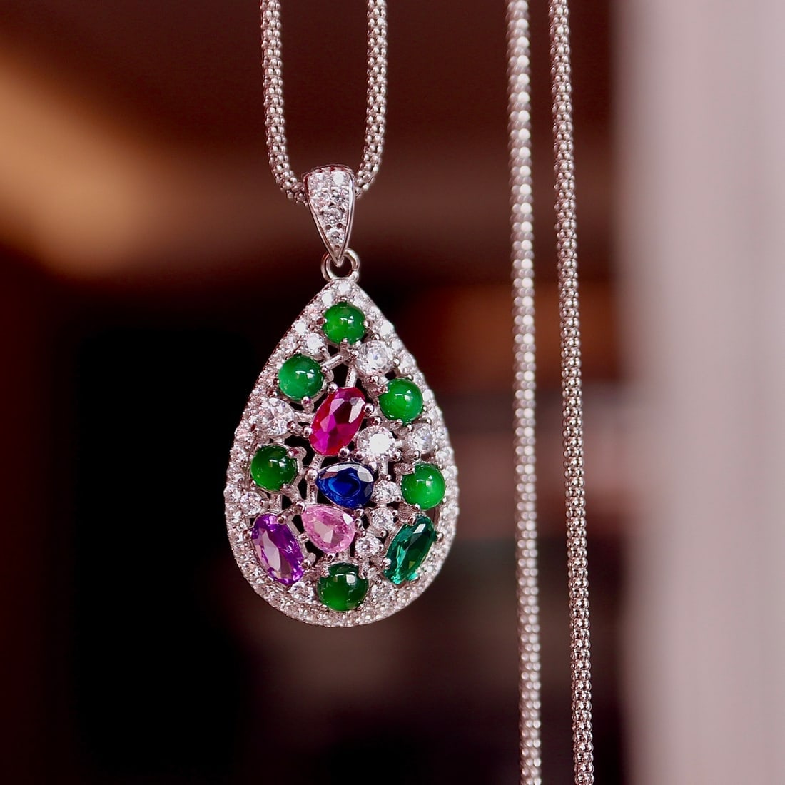 S925 Sterling Silver Natural Jade Pendant: This pendant features natural Jade, exuding a rich golden and cool white hue with a lustrous elegance. Crafted with S925 silver and plated with 18k white gold, it seamlessly blends Eastern and Western