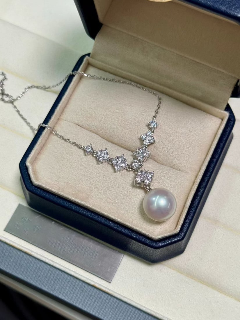 S925 Silver Perfect Round Pearl Necklace: This necklace features S925 silver with 11-12mm perfect round pearls, showcasing a natural cool white luster. The pearls are nearly flawless, exuding a noble elegance. Reserve: $400.00 Shipping: Domes
