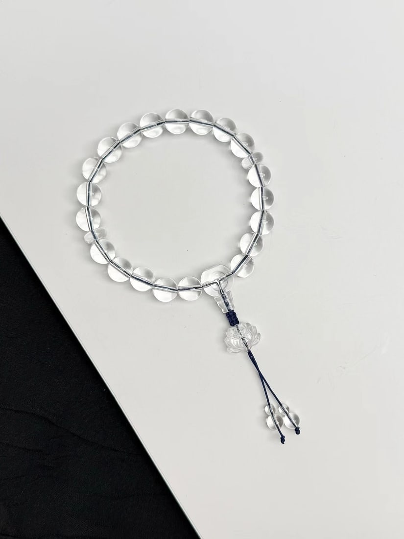 White Crystal Handheld Prayer Beads: This handheld prayer bead is crafted from natural white crystal, with a bead diameter of approximately 10mm, showcasing a cool white luster. Each bead is finely polished to ensure its perfect roundnes