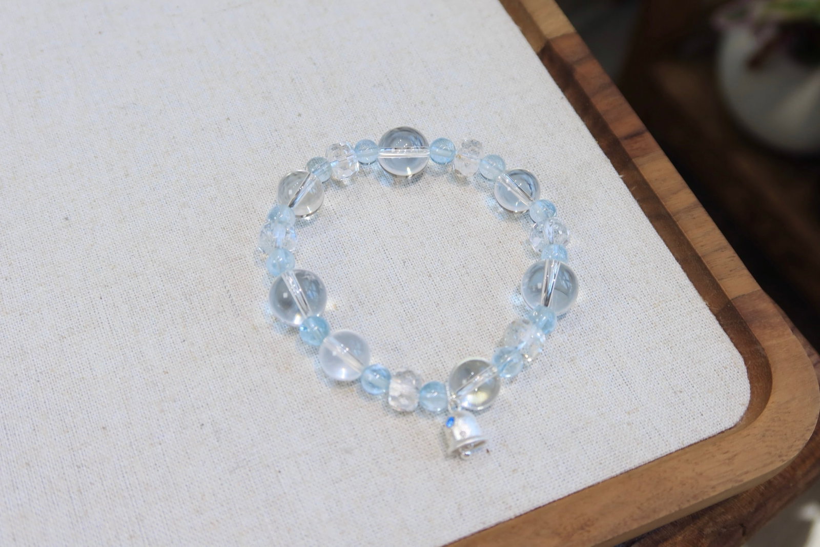 Brushed Silver Topaz Bracelet: This bracelet features natural topaz, showcasing a cool white hue with an icy translucent texture. Paired with 12.5-10mm white crystal bubble beads, the faceted white crystal complements the brushed s