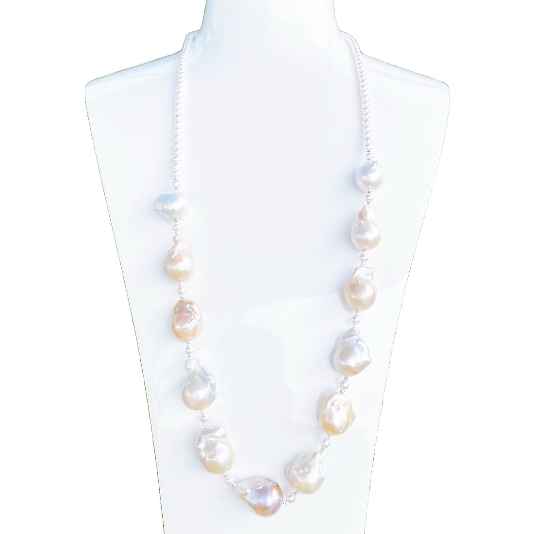 Baroque Pearl Sweater Necklace: This Baroque Pearl Sweater Necklace is renowned for its unique dual-tone design, showcasing the natural luster of rich gold and cool white. The large diameter pearls create a perfect visual balance of