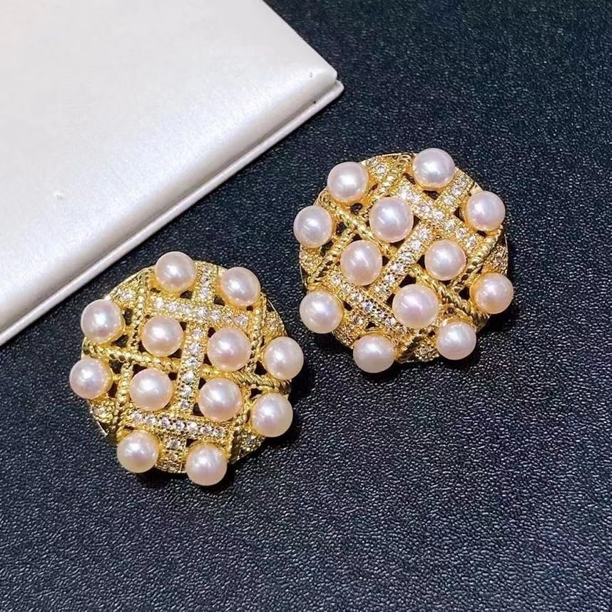 Pearl earrings: The multi-pearl arrangement showcases natural luster and texture, complemented by finely crafted sterling silver posts. Reserve: $100.00 Shipping: Domestic: Shipping rates are determined by destinatio