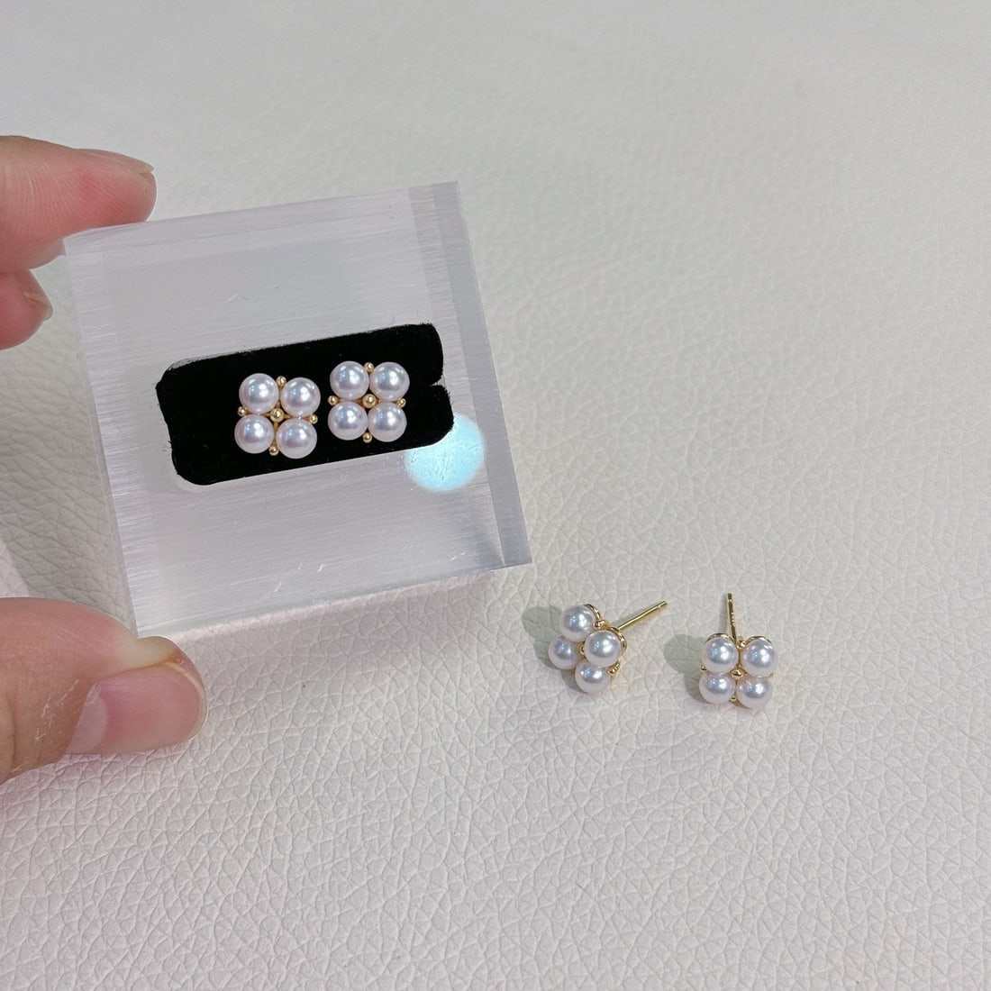 Sterling Silver Natural Freshwater Pearl Earrings: These earrings are crafted from sterling silver and feature natural freshwater pearls, showcasing a rich golden and cool white luster. Each pearl is 3-4mm in diameter, nearly flawless and perfectly ro