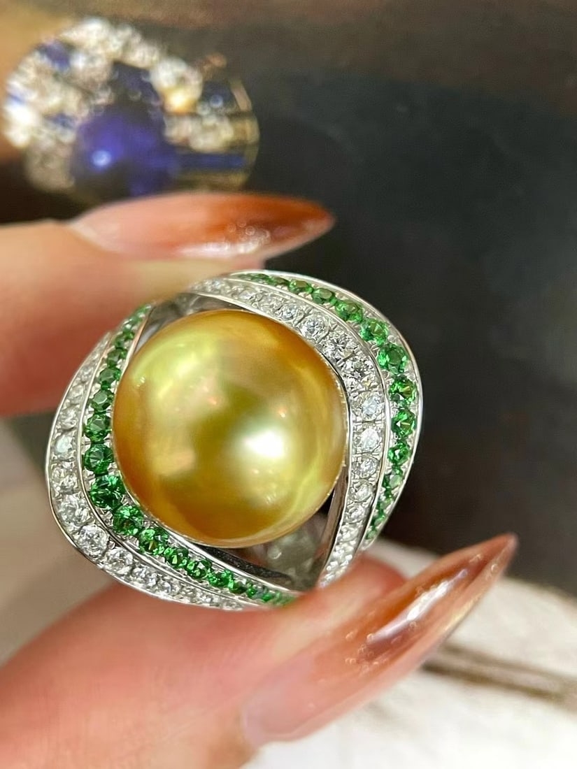 925 Silver Natural South Sea Gold Pearl Ring: This ring features a meticulously crafted 925 silver setting, showcasing the unique allure of natural South Sea gold pearls. The pearls, with a diameter of 12-13mm, are nearly round with a smooth, fin