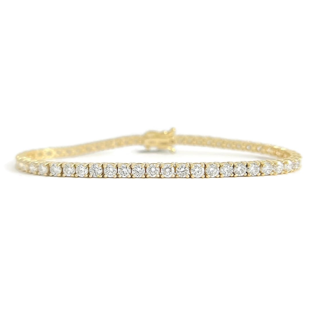 Round Lab-Created Diamond Tennis Bracelet 14K Yellow Gold, 7 Inches, 5.56 CTW: Round Lab-Created Diamond Tennis Bracelet 14K Yellow Gold, 7 Inches, 5.56 CTW This is a gorgeous and classic tennis bracelet! Please let us know if you have any questions :) Diamonds: 56 lab-created r