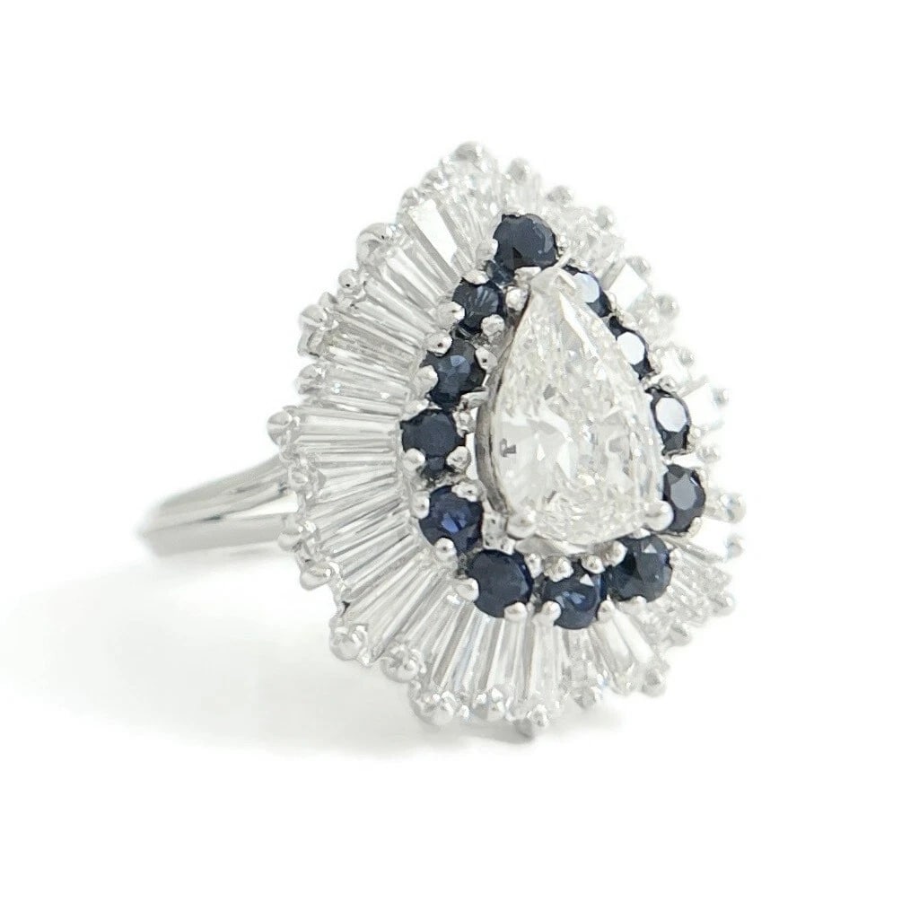 Pear Diamond Baguette Halo Blue Sapphire Cocktail Ring, Platinum, 3.84 CTW: Pear Diamond Baguette Halo Blue Sapphire Cocktail Ring, Platinum, 3.84 CTW This is a gorgeous diamond cocktail ring! Please let us know if you have any questions! Diamonds: 3.26 ctw; 1 pear shape 1.01