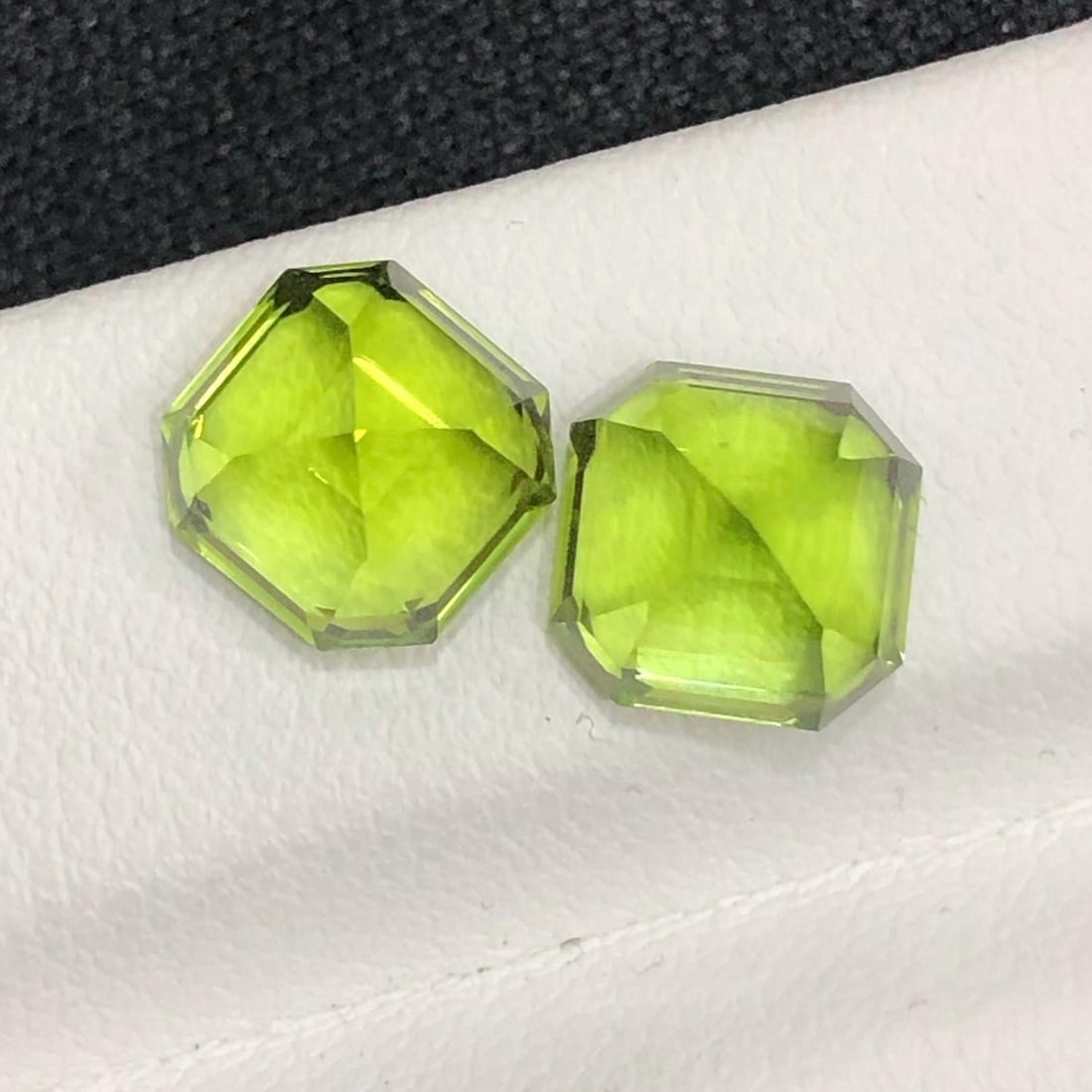 Apple Green Peridot Gemstone Set: Ascher Cut, Sapat Valley , 5.60 CT: Materials: Gemstone: Peridot Carat weight: 5.60 Peridot Details: * Weight : 5.60 carat * Dimension : 7.31x7.31x6.32 MM * Color : Apple Green * Shape : Emerald * Hardness : 6.5 - 7 * Mineral Class : Ol