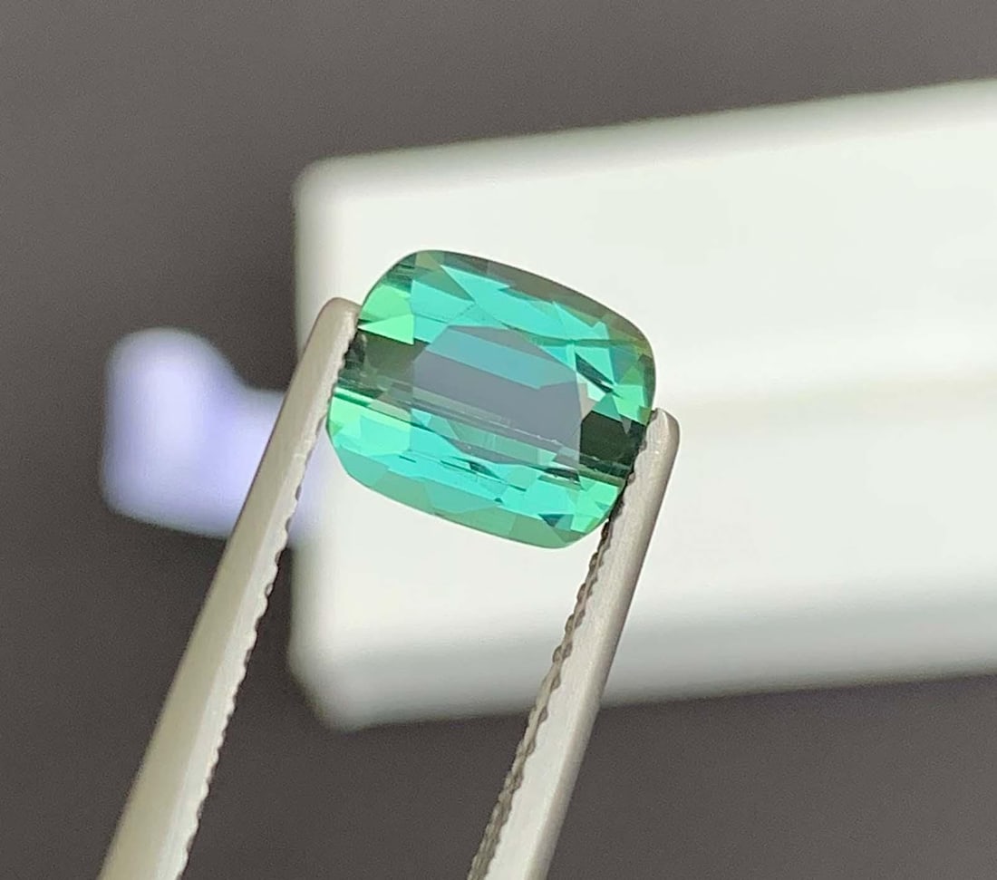 Blue Green Tourmaline Gemstone: Natural October Birthstone, Africa (2.36 CT): Materials: Gemstone: Tourmaline Blue Green Tourmaline Gemstone: Natural October Birthstone, Africa Weight : 2.36 Carat Dimensions : 7.600 * 6.500 * 4.800 mm Shape : Fancy Cut Clarity : Loupe Clean Col
