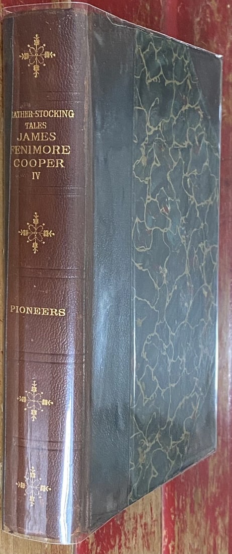 James Fenimore Cooper PIONEERS 1898 Leather Stocking Tales Fireside Ed. Antique: James Fenimore Cooper PIONEERS 1898 Leather Stocking Tales Fireside Edition, Antique Book. Black and red illustrated title page. Very good condition. 483 pages. Hardcover leather binding with marbled 