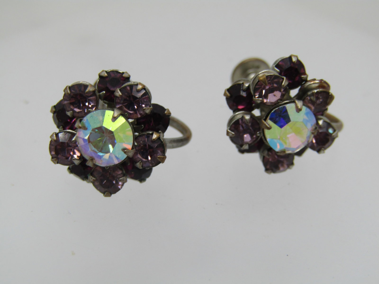 Vintage Purple AB Rhinestone Earrings, 1940's, Blossom Screwback: Vintage Purple AB Rhinestone Earrings, 1940's, Blossom. Tieried blossom with with a lower level of round purple rhinestones and a secnd tier of lavender and then a center larger clear aurora borealis 