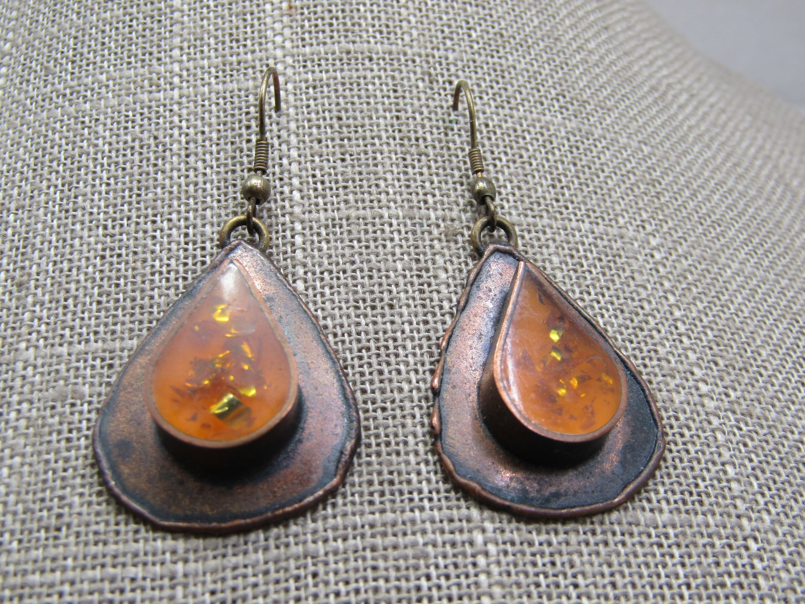 Vintage Copper & Brass Resin/Glitter Earrings, Hand Made Pierced: Vintage Copper & Brass Resin/Glitter Earrings, Hand Made Pierced, 1.75" long from curve in post. Appx. 1" wide at widest point. These have an orange clear resin teardrop bezel-set stone with amber col