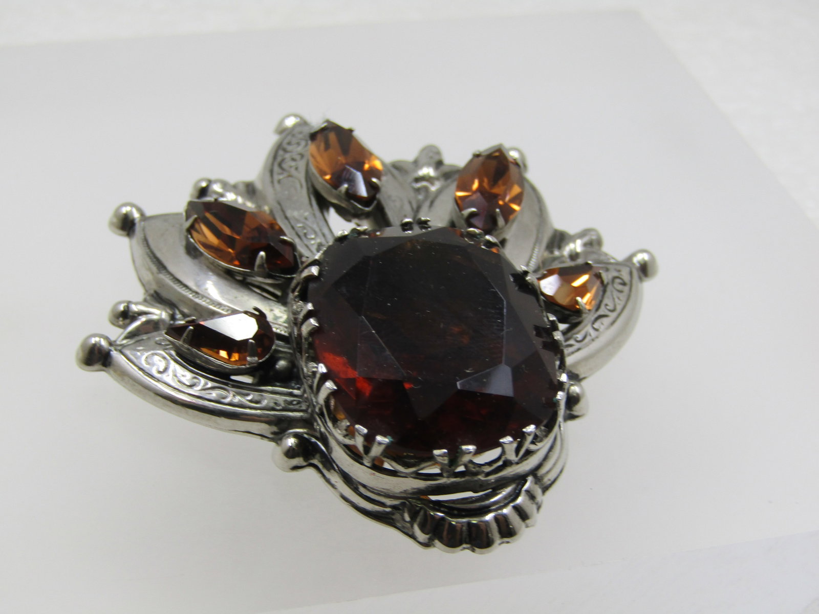 Vintage Smoky Rhinestone Brooch & Earrings, Sarah Coventry. 1960's.: Vintage Smoky Rhinestone Pointed Statement Brooch/Pendant Signed Accessocraft NYC, 1960's-1970's. This has five pointed rays that lead upward from the large topaz rhinestone - each of the fingers of