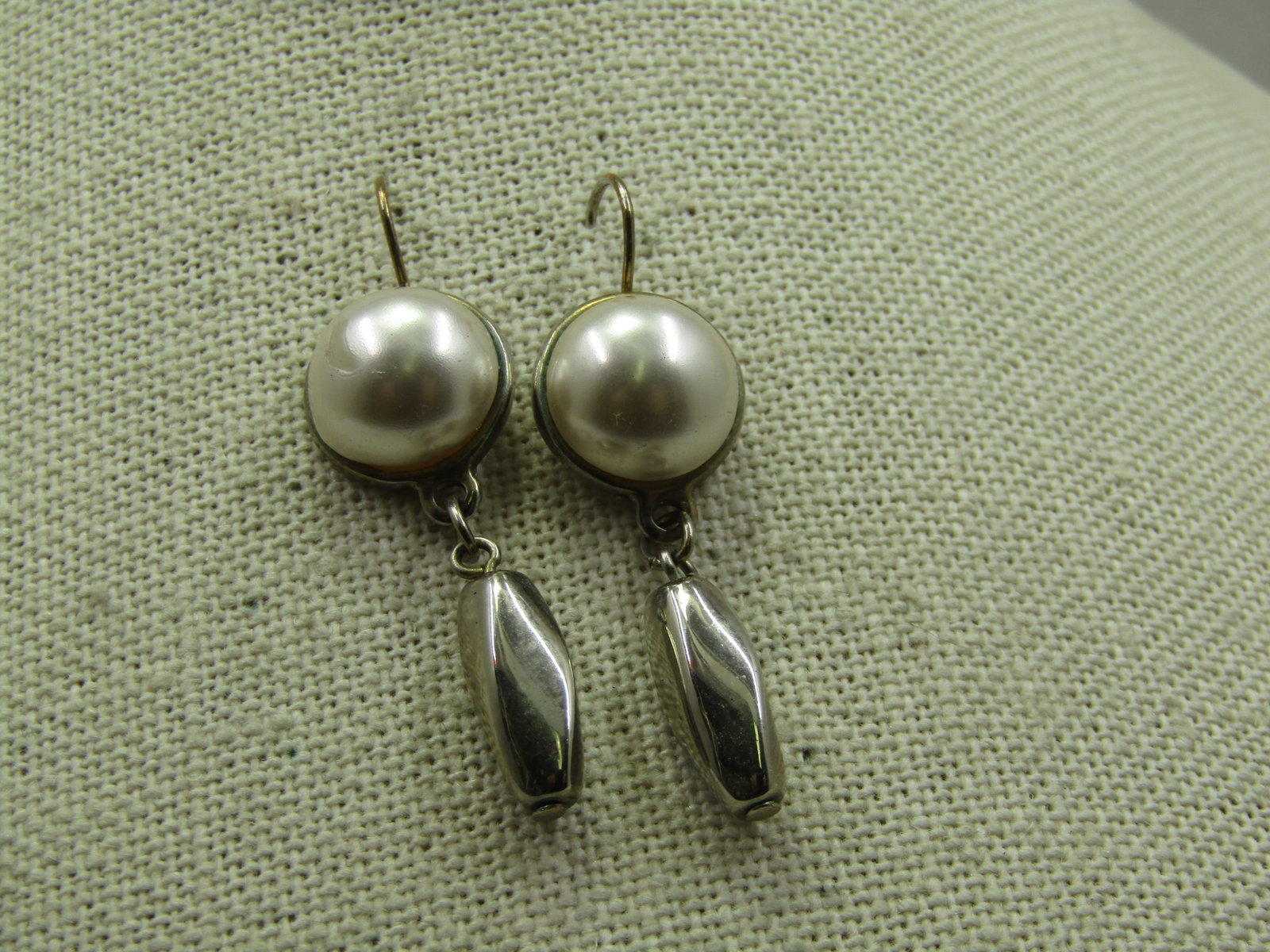 Vintage Faux Pearl Dangle Earrings, Pierced, 1980's: Vintage Faux Pearl Dangle Earrings, Pierced, 1980's. Hook posts and are appx. 1.75" long from the curve in the hook post. They have a half round faux pearl cabochon set on the upper "stud" portion