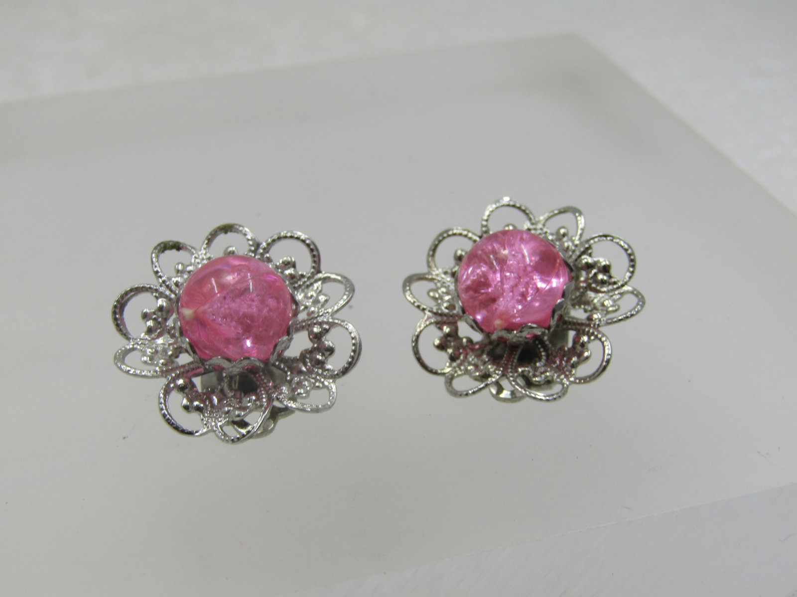 Vintage Pink Beaded Filigree Earrings, Clip, 1960's: Vintage Pink Beaded Filigree Earrings, Clip, 1960's. Blossom design with a pink filigree textured blossom base and a pink plastic 10mm round bead set in the center with a fiilgree cap holding the pink