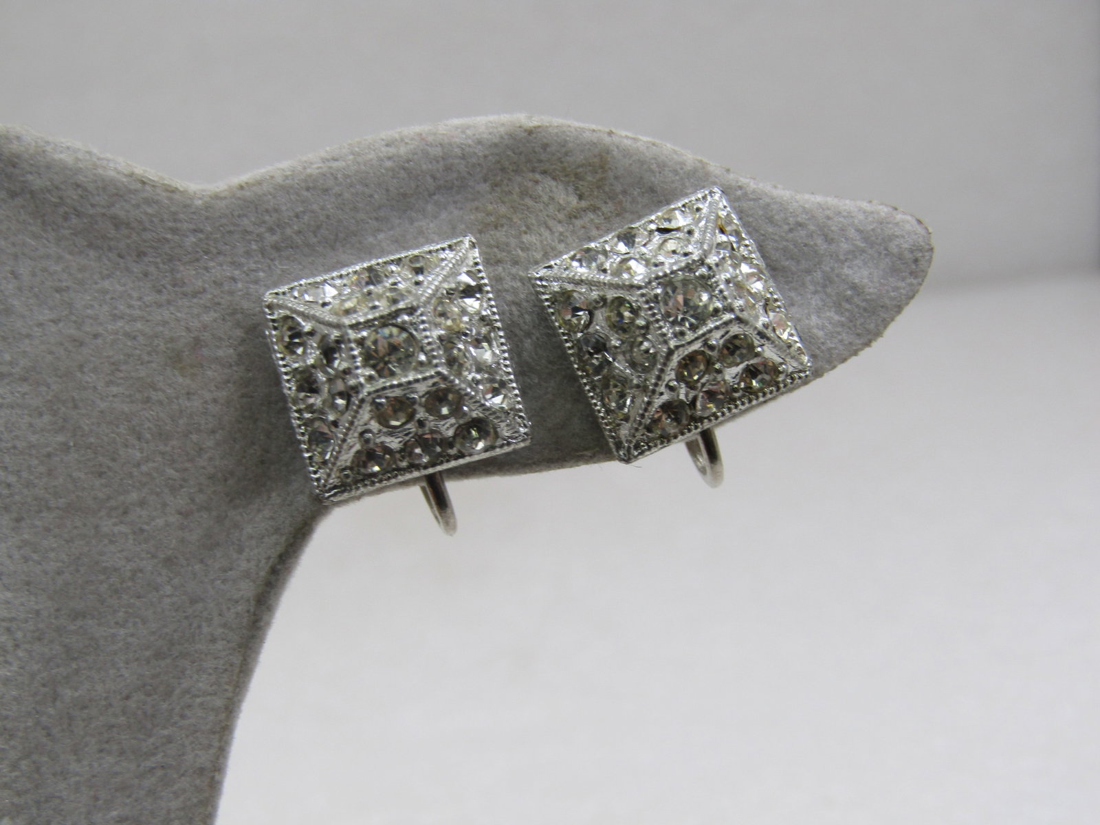 Vintage Rhinestone Pyramid Shaped Earrings, Screwbck, Mid-Century: Vintage Rhinestone Pyramid Shaped Earrings, Screwbck, Mid-Century. They have a 1/2" square base with pave set clear rhinestones throughout. The earrings narrow as they go up and are pyramid shaped exc
