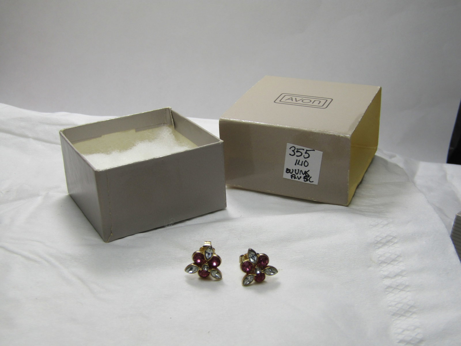 Vintage Avon Pink Sparkle Earrings, Pierced, In Original Box: Vintage Avon Pink Sparkle Earrings, Pierced, In Original Box with Sleeve, 1985. Pink round rhinestones and marquise clear stones. Pointed blossom design. Very good condition. New Old Stock. ((INV.WUNK