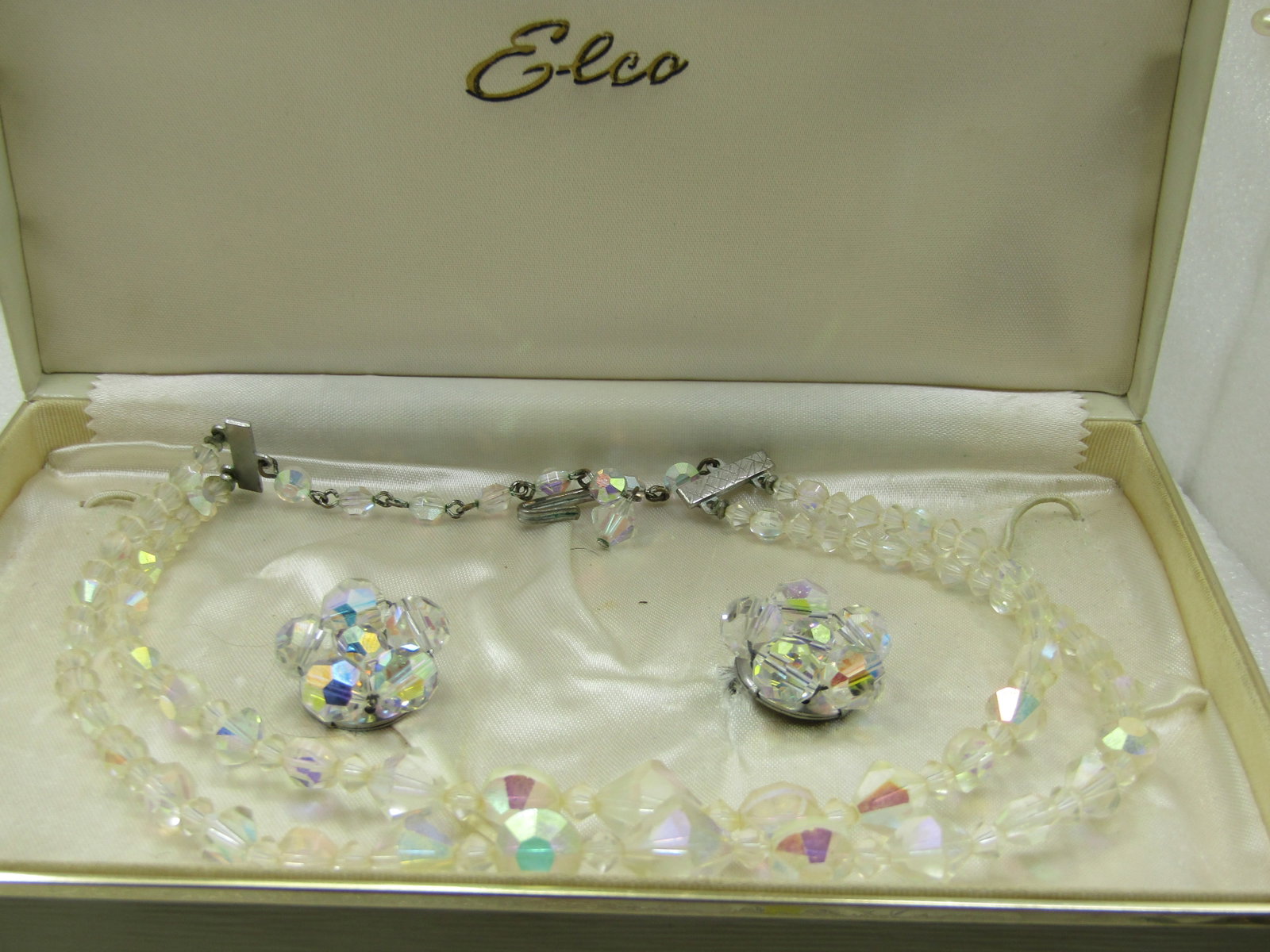 Vintage Double Strand Aurora Borealis Neckace & Earrings Demi Parure, Mid-Century, Elco: Vintage Double Strand Aurora Borealis Neckace & Earrings Demi Parure, Mid-Century, Elc. Silver tone end bars to the double strands of aurora borealis crystal beads that are in a diamond faceted shape 