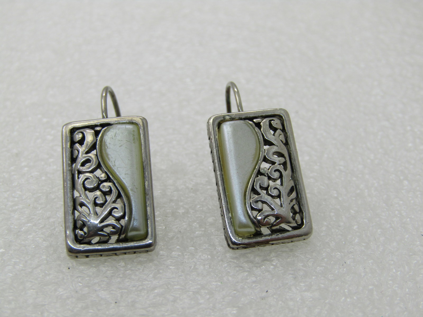 Vintage Scrolled & Pearly Earrings, Pierced, Lever Backs, 1" Rectangular: Vintage Scrolled & Pearly Earrings, Pierced, Lever Backs, 1" Rectangular, 1980's-1990's. One side is a curved faux pearly insert and the other is a scrolled cut-out design. In a bezel-setting frame.