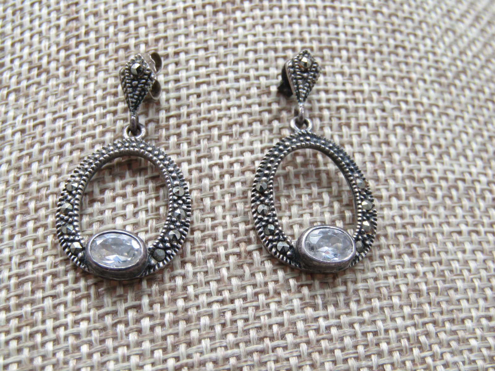 Vintage Sterling Marcasite Drop Hoop Earrings, Signed CW: Vintage Sterling Marcasite Drop Hoop Earrings, Signed CW and signed CW and marked .925. Tested too with weight of 3.97 gr. Thse have a pointed tapered stud with marcasites from which a 3/4" flat hoop