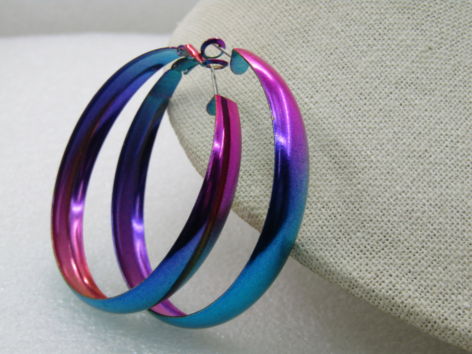 Vintage Metallic Multi-Colored Large Hoop Pierced Earrings, 2.5": Vintage Metallic Multi-Colored Large Hoop Pierced Earrings, 2.5". Throw-back look to the 1960's, 6mm to 9mm wide. Metallic painted in rainbow-ish colors green, yellow pink purple blue. Very good condi
