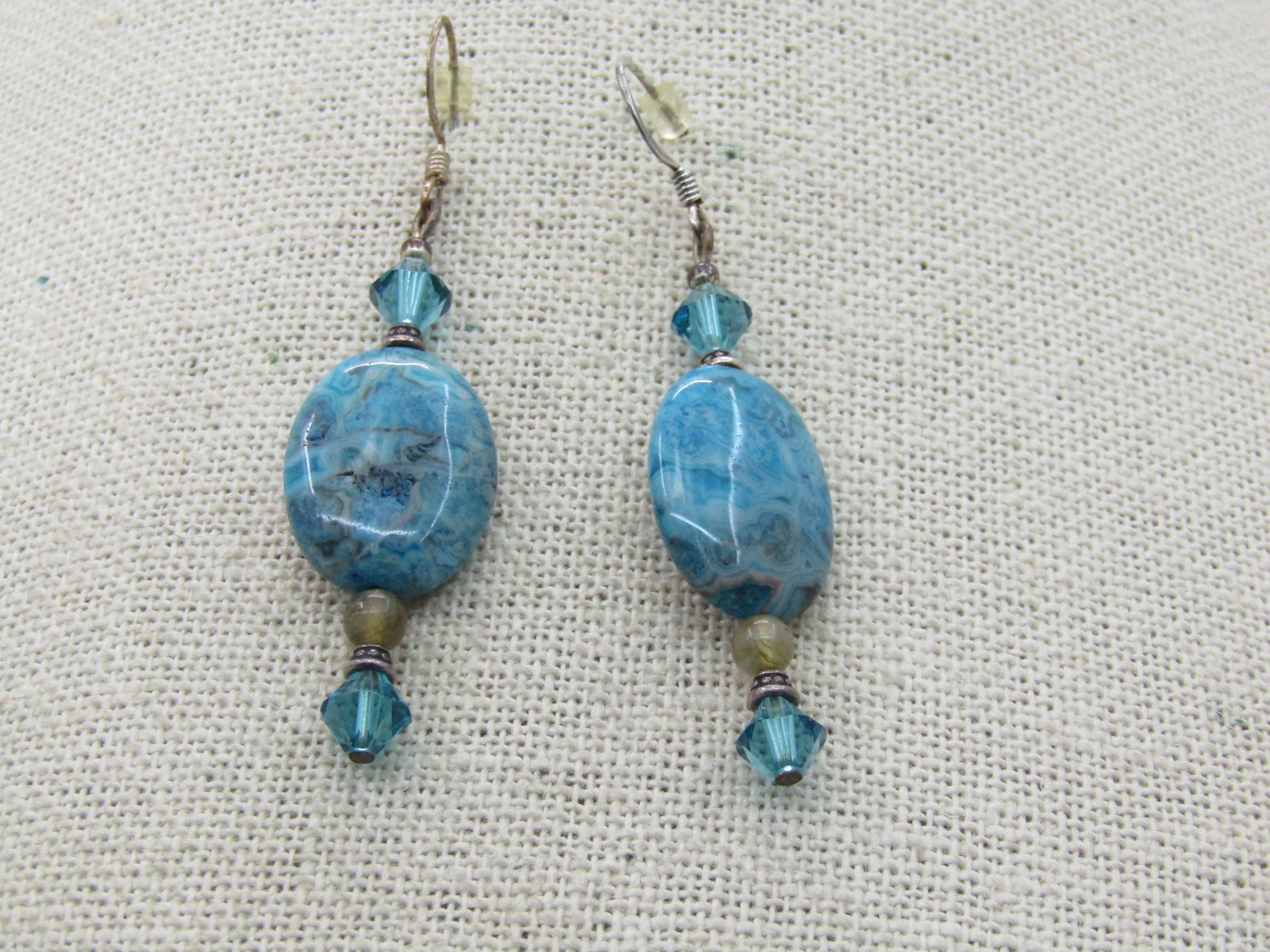 Turquoise & Crystal Drop Pierced Earrings, Silver Tone: Turquoise & Crystal Drop Pierced Earrings, Silver Tone. 2.5" earrings with crystal teal beds that compliment a smoth nearly 1" long turquoise colored stone that does not test as glass and looks like a