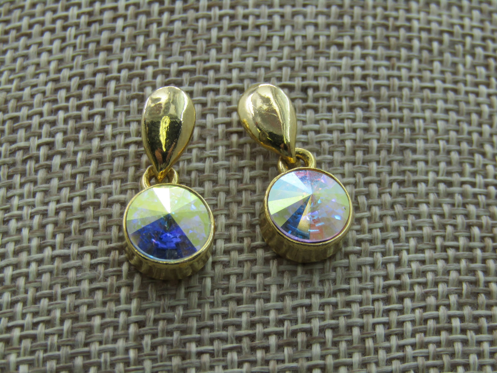 Vintage Rivoli Rhinestone Earrings, Pierced, Stud and dangle. 1980's.: Vintage Rivoli Rhinestone Earrings, Pierced, Stud and dangle. 1980's. 8.5mm round aurora borealis rivoli stone dangle from a gold tone stud. 3/4" long and slightly under 1/2" wide. Very good condition