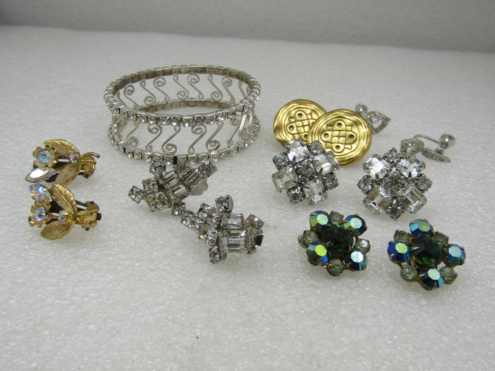 Vintage 7 Rhinestone Earrings Bracelet Lot, Weiss, DB, Austria: Vintage 7 Rhinestone Earrings Bracelet Lot, Weiss, DB, Austria, 1950's-1960's, 1 current. There are three pair of Weis clear rhinestone earrings and one green with aurora borealis shimmer 2 clip and o