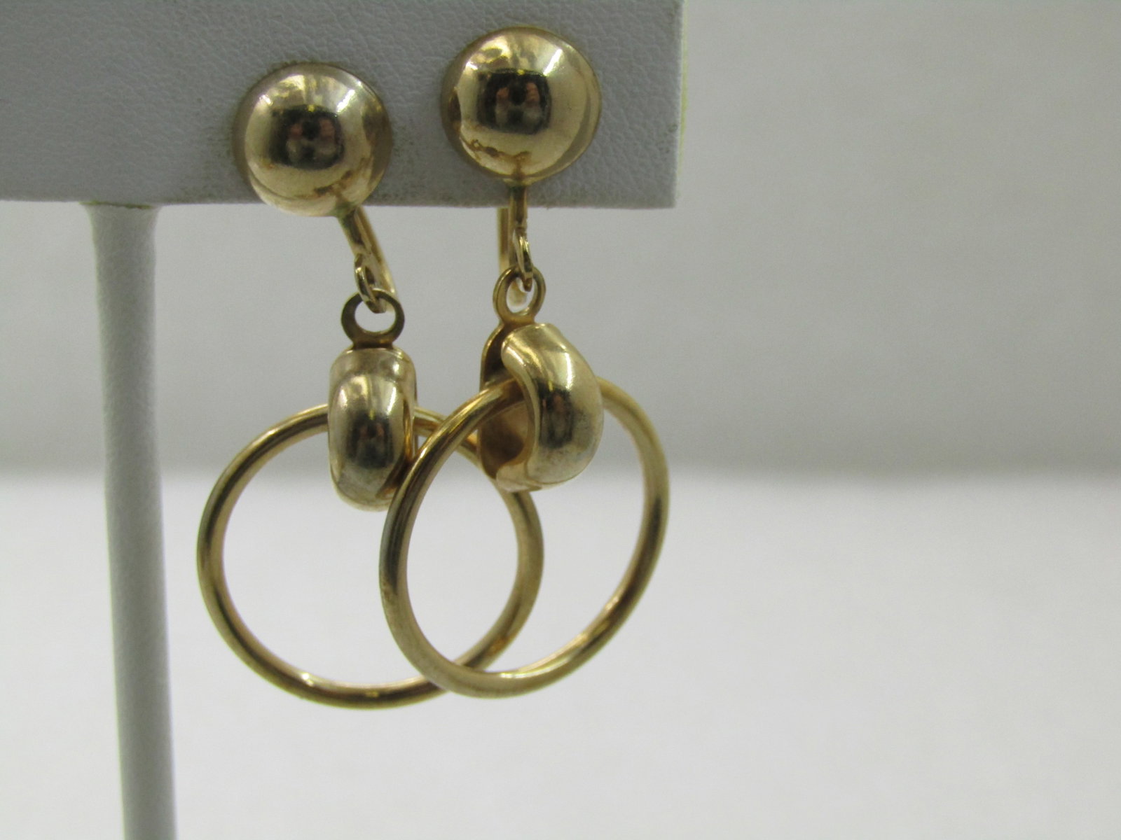 Vintage Stud & Dangle Hoop Earrings, Screw Back, Gold Tone, 1970's-1980's: Vintage Stud & Dangle Hoop Earrings, Screw Back, Gold Tone, 1970's-1980's, 1-5/8" long with a half-ball stud and a 3/4" wire hoop that hangs sideways through a gold tone drop. Not signed by the maker.