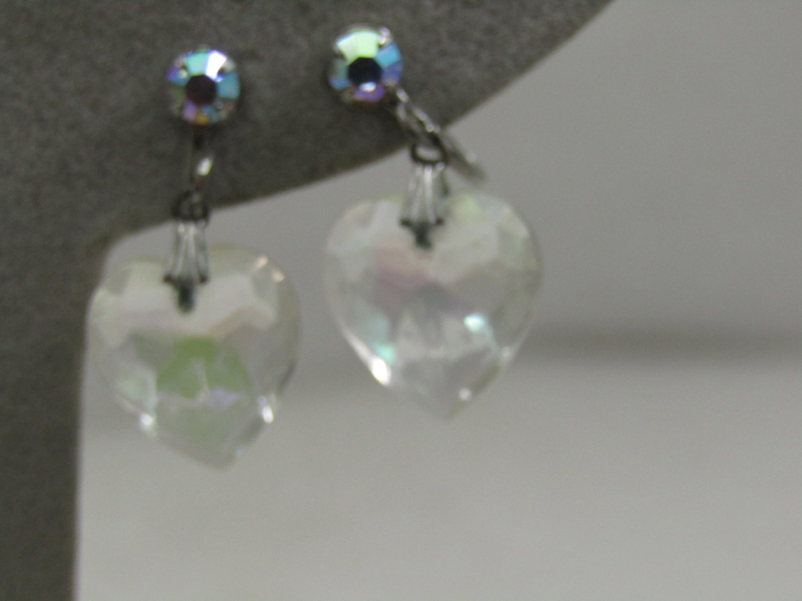 Vintage Aurora Boralis Crystal Heart Dangle Earrings, Screw Back: Vintage Aurora Boralis Crystal Heart Dangle Earrings, Screw Back, 1960's. The hearts are faceted with rainbow shimmer. They are appx. appx. 3/4" long and dangle from the above mechanism that has a