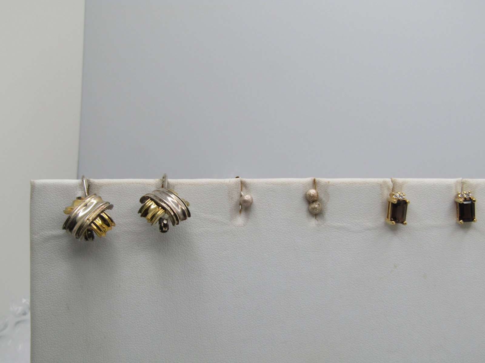 Vintage 3 Pr. Earring Lot, Sterling & Costume, 1970's-1980's: Vintage 3 Pr. Earring Lot, Sterling & Costume, 1970's-1980's. There are three earrings of the same design - textured 3.5mm round stud - marked sterling and test. The three weigh .73 gr. Gold tone