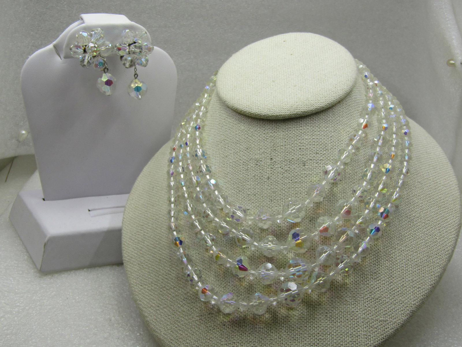 Vintage Four Strand Clear Crystal Necklce & Clip Earring Set, Aurora Borealis, 16", 1940's-1950's: Vintage Four Strand Clear Crystal Necklce & Clip Earring Set, Aurora Borealis, 16", 1940's-1950's. Crystal beads in graduated size from 5.5mm to 1mm beads with smaller beads between the beads as they 