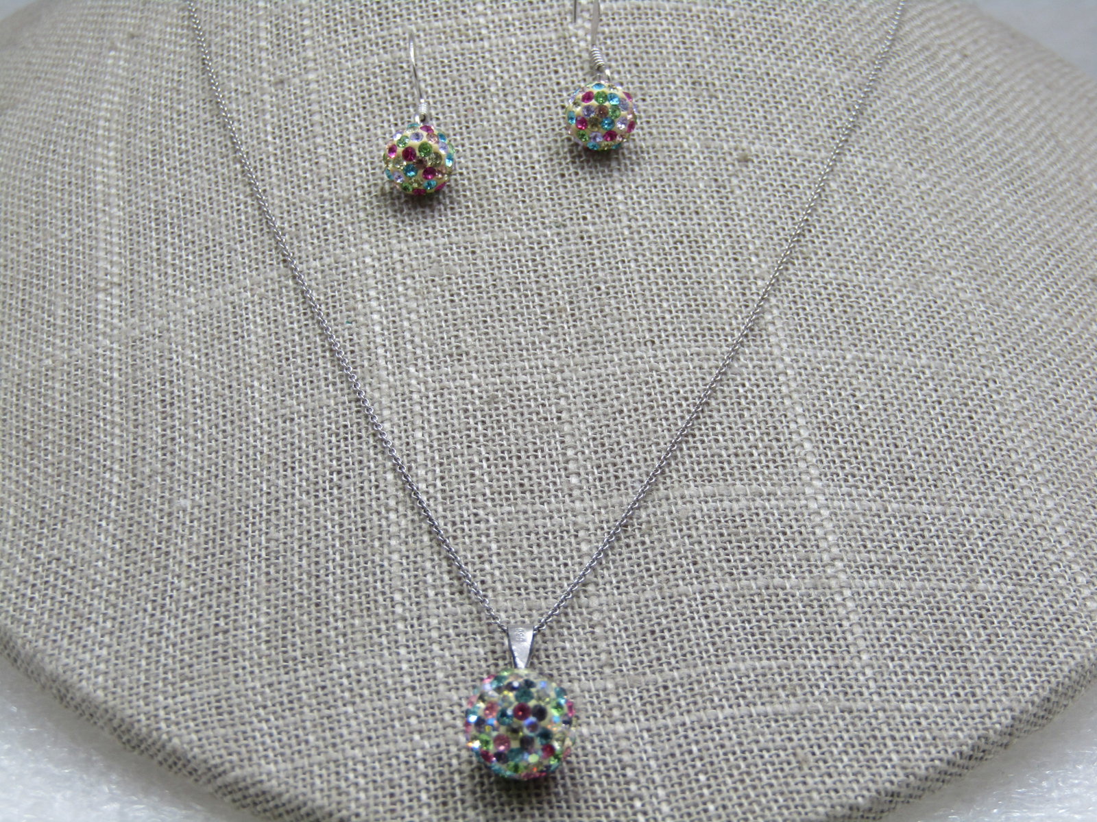 Sterling Pave Pastel Rhinestone Ball Necklace Earrings Set, 18": Sterling Pave Pastel Rhinestone Ball Necklace Earrings Set, 18", 3.76 gr. The necklace has an appx. 10mm round bead pave set with multi-colored rhinestones, swing bail. The earrings are pierced with a