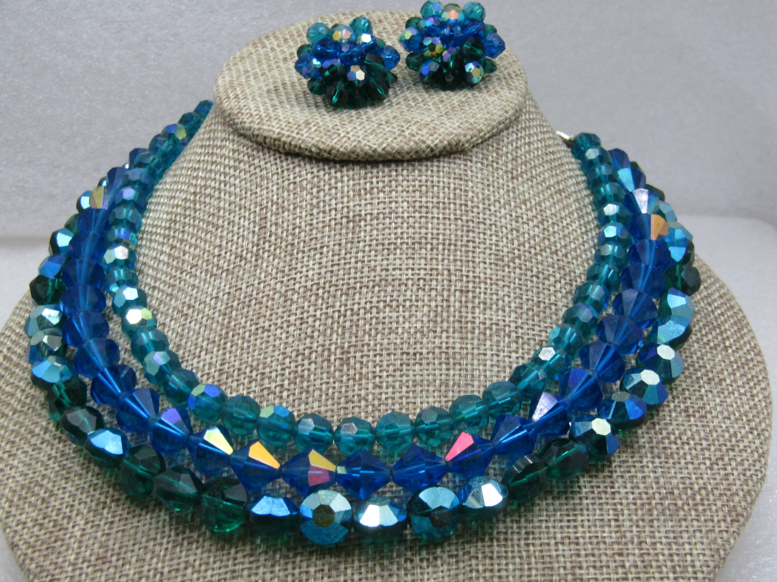 Vintage Peacock & Blue Aurora Borealis Necklace Earrings Demi Parure, 1940's-1950's: Vintage Peacock & Blue Aurora Borealis Necklace Earrings Demi Parure, 1940's-1950's. Three strands, each with a different bead. Two steands are the peacock green with blue aurvora borealis shimmer. On