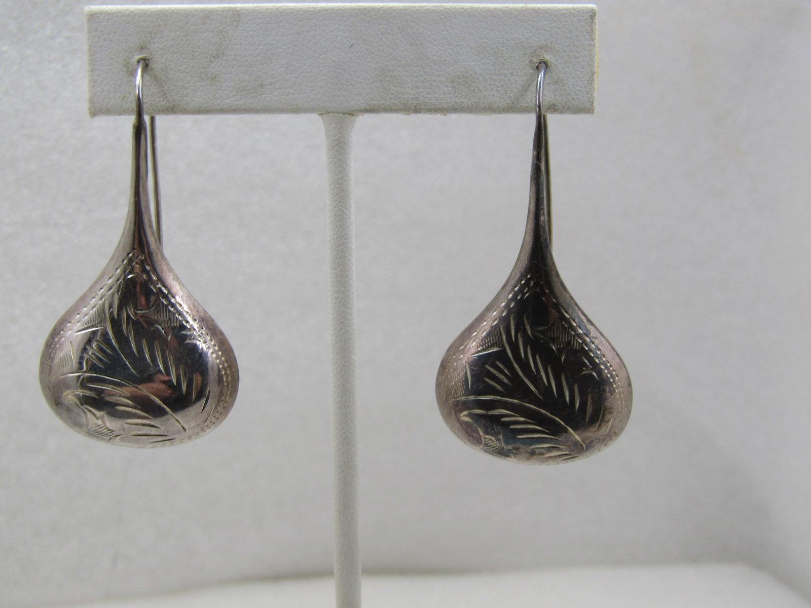 Vintage Southwestern Sterling Puffy Engraved Earrings, Pierced 2": Vintage Southwestern Sterling Puffy Engraved Earrings, 2" long curved hook pierced posts. The earings are marked .925 and the curve of the p osts and weight is appx. 10.50 gr. They have been tested