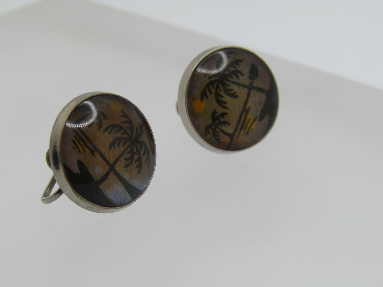 Vintage Morpho Beach Scene Earrings, Screwback, 1950's-1960's: Vintage Morpho Beach Scene Earrings, Screwback, 1950's-1960's. Butterfly wings in the background and a beach scene in the front. 3/4" round, slightly domed. Silver tone metal. Not signed or marked. Th