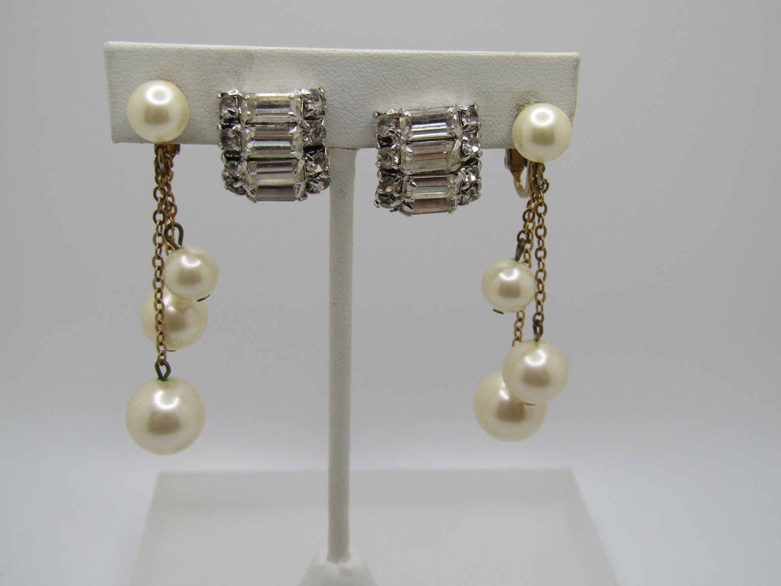 Vintage Pair of Rhinestone & Faux Pearl Earrings, 1950's: Vintage Pair of Rhinestone & Faux Pearl Earrings, 195. Thre are clear rhinestonie bridal style earrings that have a Patent 1967965 which was obtained by Ballou. These are silver tone clips with round 