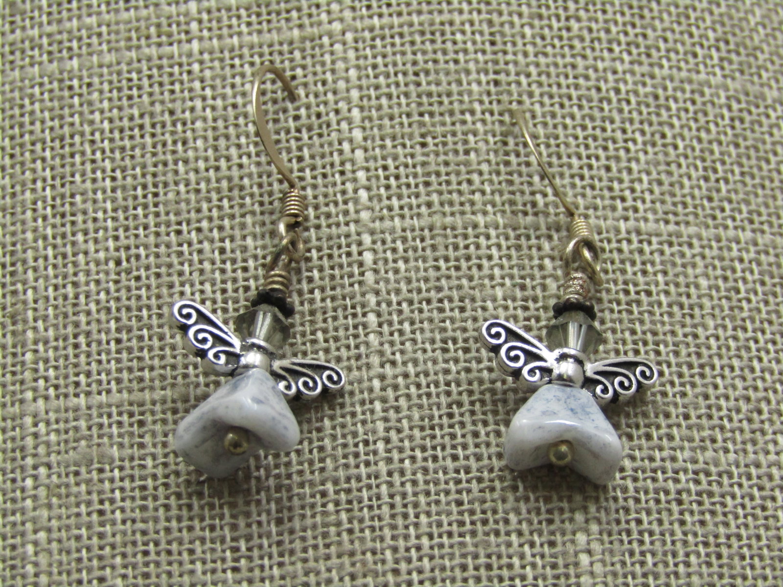 Silver Angel Agate Earrings, Pierced, 1.5": Silver Angel Agate Earrings, Pierced, 1.5" long and 1/2" wide. The hook post is a siler tone metal with silver plated angel wings, a smokey crystal bead for the head and an agate triangular nugget for