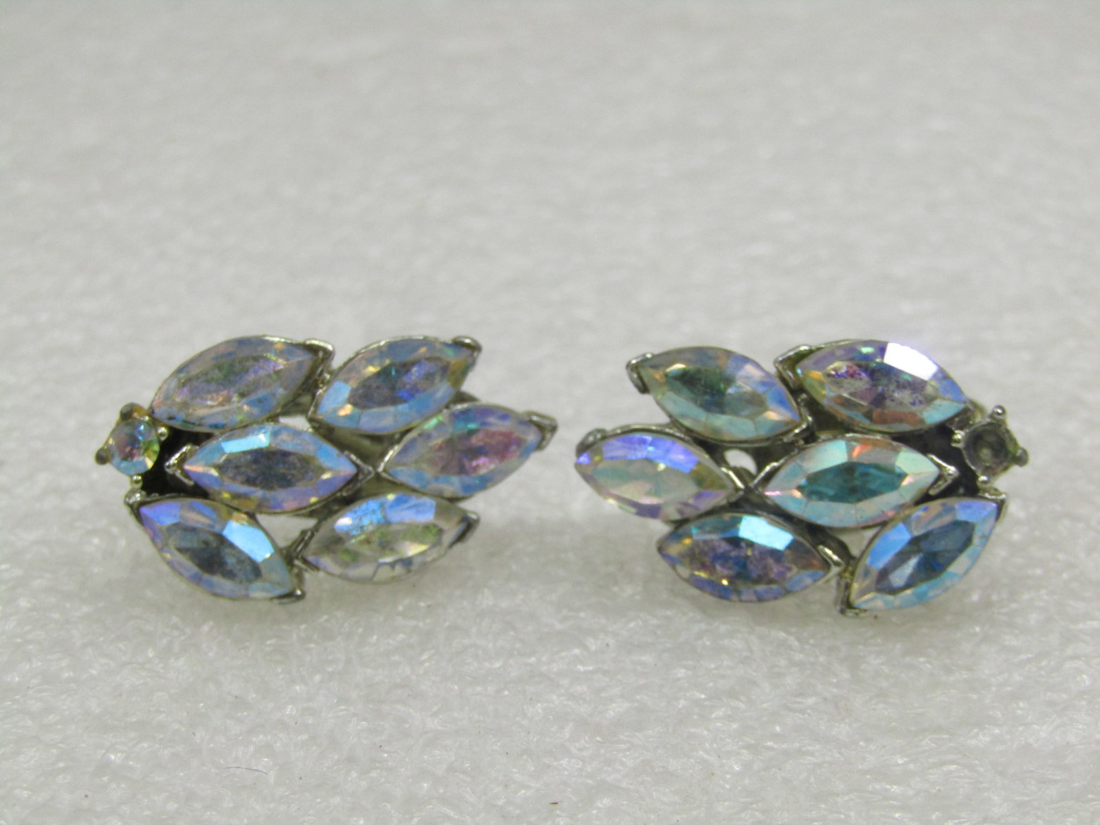 Vintage Aurora Borealis Leaf Clip Earrings, 1": Vintage Aurora Boralis Leaf Clip Earrings, 1" by 5/8" . Made up of 6 marquise aurora borealis marquise stones that are appx. 10mm by 5mm with a single round3mm stone at what would be the stem of the