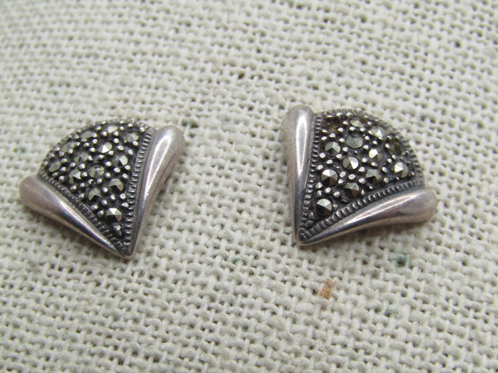 Vintage Sterling Marcasite Earrings, Pierced, Art Deco Themed: Vintage Sterling Marcasite Earrings, Pierced, Art Deco Themed. They have a fan shape with the center V having marcasites set throughout and the outer V shape is domed and tapered in a smooth finish.