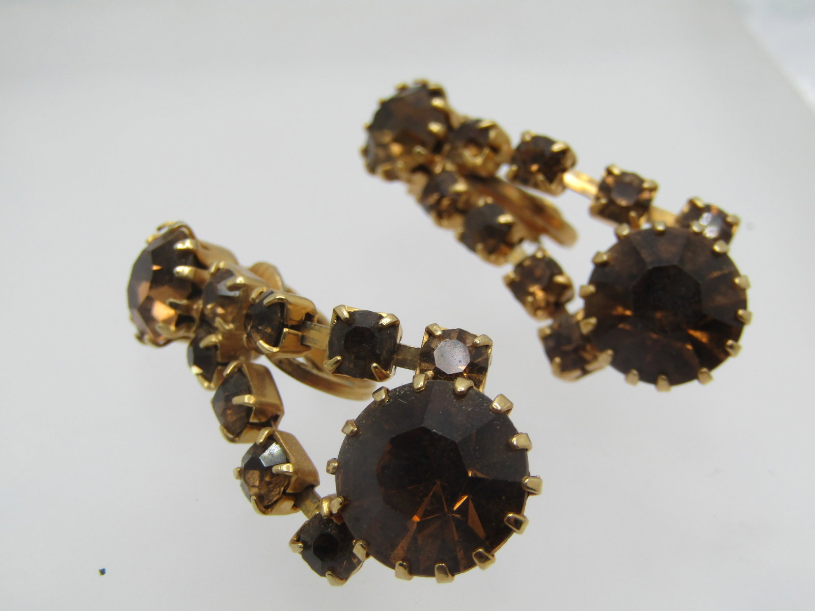 Vintage Amber Rhinestone Stud & Drop Earrings, Clip, 1940's-1960's: Vintage Amber Rhinestone Stud & Drop Earrings, Clip, 1940's-1960's. Gold tone setting. The stud is appx. 8mm round with two strands of matching amber rhinestones leading to a bottom 11mm matching ston