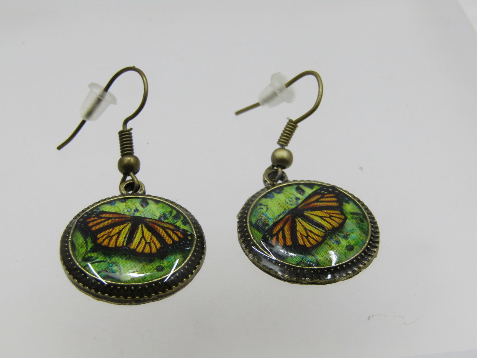 Vintage Monarch Butterfly Drop Pierced Earrings, 1980's-1990's: Vintage Monarch Butterfly Drop Pierced Earrings, 1980's-1990's. Brass tone that appear to have not been worn. They are appx. 1.5" long from the curve in the post and the drops themselves are appx.