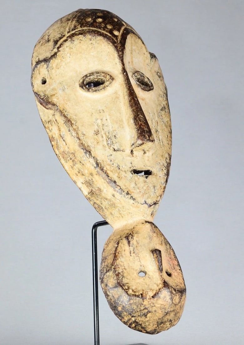 AFRICAN ART Rare & large 15" mask with handle and two faces LEGA Congo: AFRICAN ART Rare mask with handle and two faces LEGA - Congo DIMENSIONS: Height 38 cm (About 15 inches) CONDITION: Fair - Good. See pictures Reserve: $325.00 Shipping: Domestic: Flat-rate of $50.00