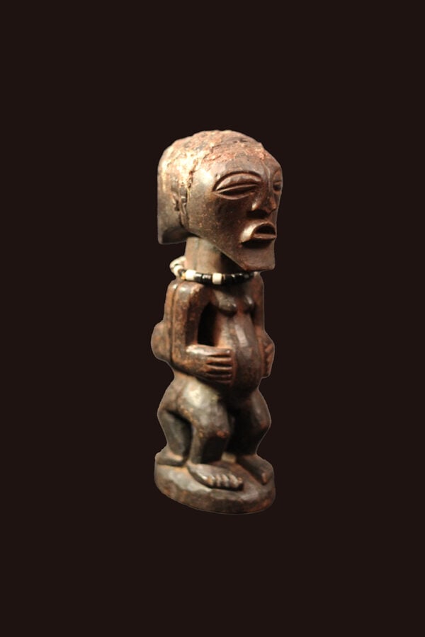 Power Figure – Wood, Beads – Songye – Congo: Great Janus Songye power figure from DR Congo. Stylistic wooden ancestor figure with 2 faces of the SONGYE tribe from D.R. Congo. It served to protect the family against diseases, accidents, bad