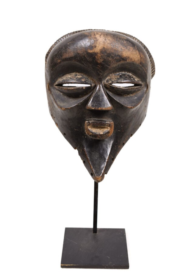 Face Mask – Wood – Mbagani – Congo: Authentic face mask from Mbagani tribe DR Congo. This type of mask were worn during the initiation proces. Showing typically enlarged concave orbits and bulging coffee-bean eyes. . Good condition with