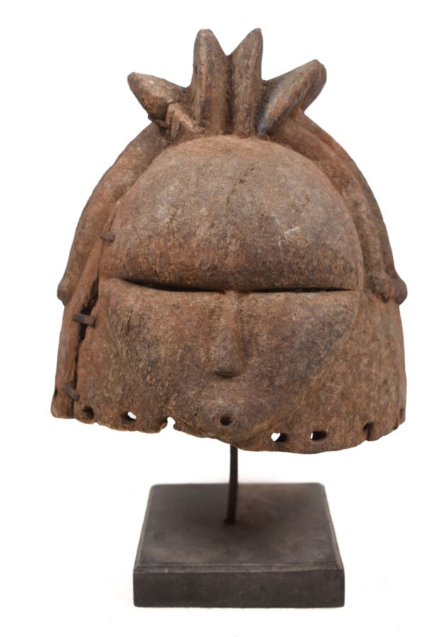 Helmet Mask – Wood – Mende – Sierra Leone: A large helmet mask from the Mende people living in Liberia and Sierra Leone. As symbol of idealized feminine beauty these masks are exclusively worn by women; they play an important role in the