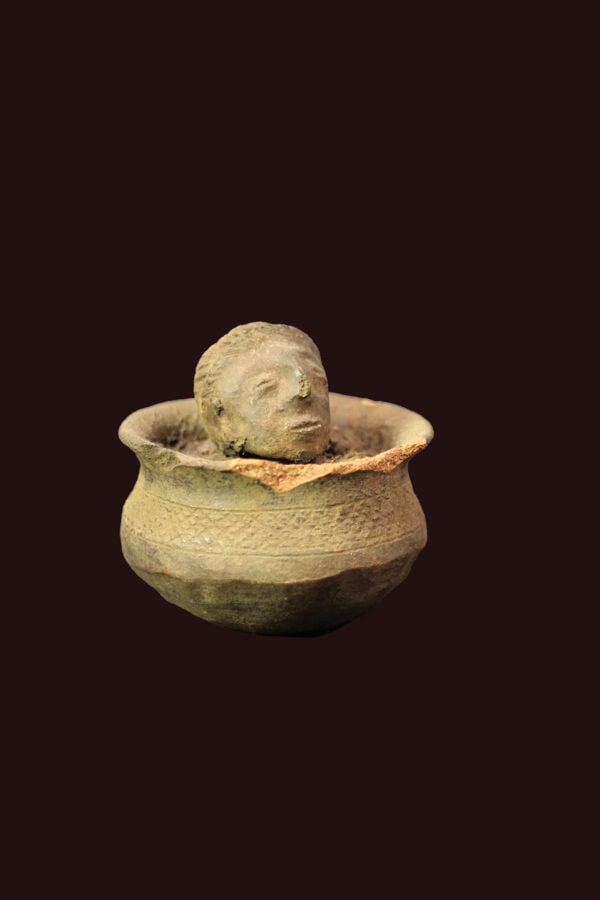 Container – Terracotta – Ewe – Togo: Old terracotta container from the Ewe people of Togo. The offering container is topped with an ancestor head. The Ewe, are the largest ethnic group in Togo. They are also found as minorities in