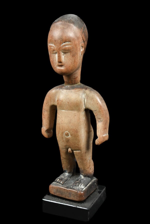 Venavi figure – Wood – Ewe – Togo: A fine venavi figure made out of wood. This miniature is used as a doll among the Ewe people. The Ewe people of Ghana celebrate the birth of twins as a good omen. Twins known as Venavi, lead a life of