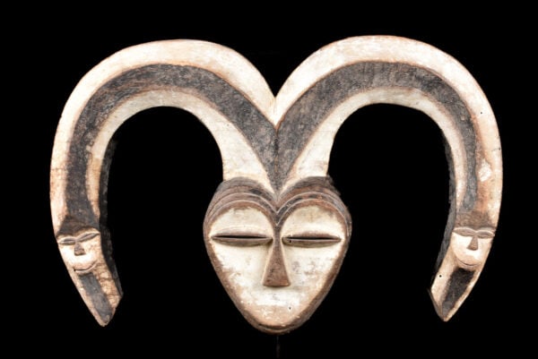 Mask – Wood – Kwele – Gabon: Beautiful hand carved wooden heart shaped mask of the Kwele tribe living in Gabon. The Kwele use several types of masks in ceremonies to promote harmonious interaction and group solidarity. Kwele mask